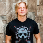 The tee being worn by Hurricanes forward Jackson Blake outdoors