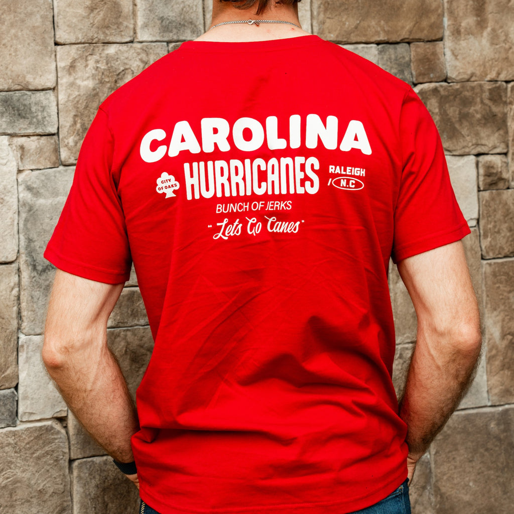 Back: "CAROLINA HURRICANES", "Bunch of Jerks", "Let's Go Canes" in white on back