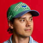 Right: White pennant patch with "1979" in green, worn by Sebastian Aho