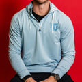 Baby blue quarter-zip with hood, Whalers Tail logo left chest in baby blue, pattern in hood