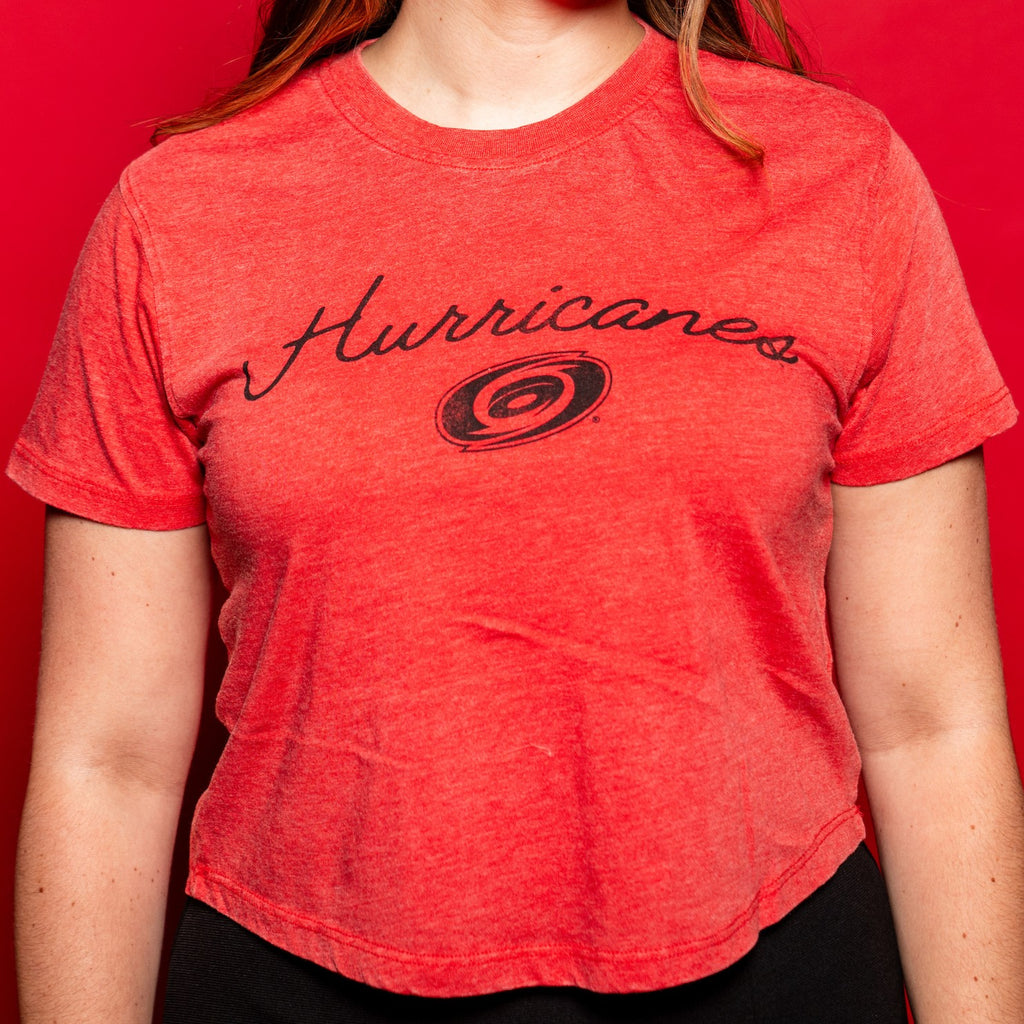 Light red tee, "Hurricanes" in black cursive across front with black Primary logo beneath wording
