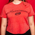 Light red tee, "Hurricanes" in black cursive across front with black Primary logo beneath wording
