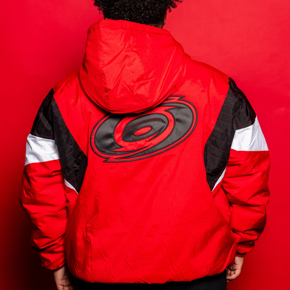 Back: Tonal logo on back, red hood
