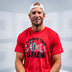 Hurricanes Captain and forward Jordan Staal posing smiling with the tee