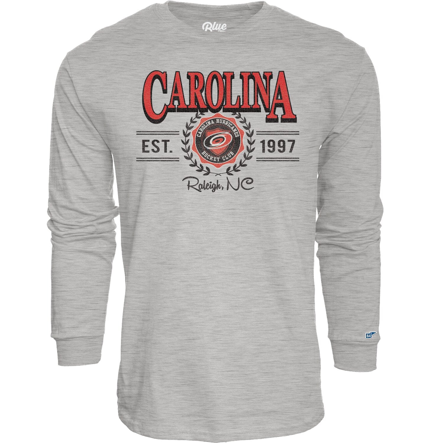 Gray longsleeve, red/black artwork on front featuring laurels, "CAROLINA" "EST. 1997", and "Raleigh, NC" around Primary logo