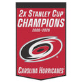 Red/black wool banner, "2x Stanley Cup Champions 2006 2026 Carolina Hurricanes" in white with Primary logo