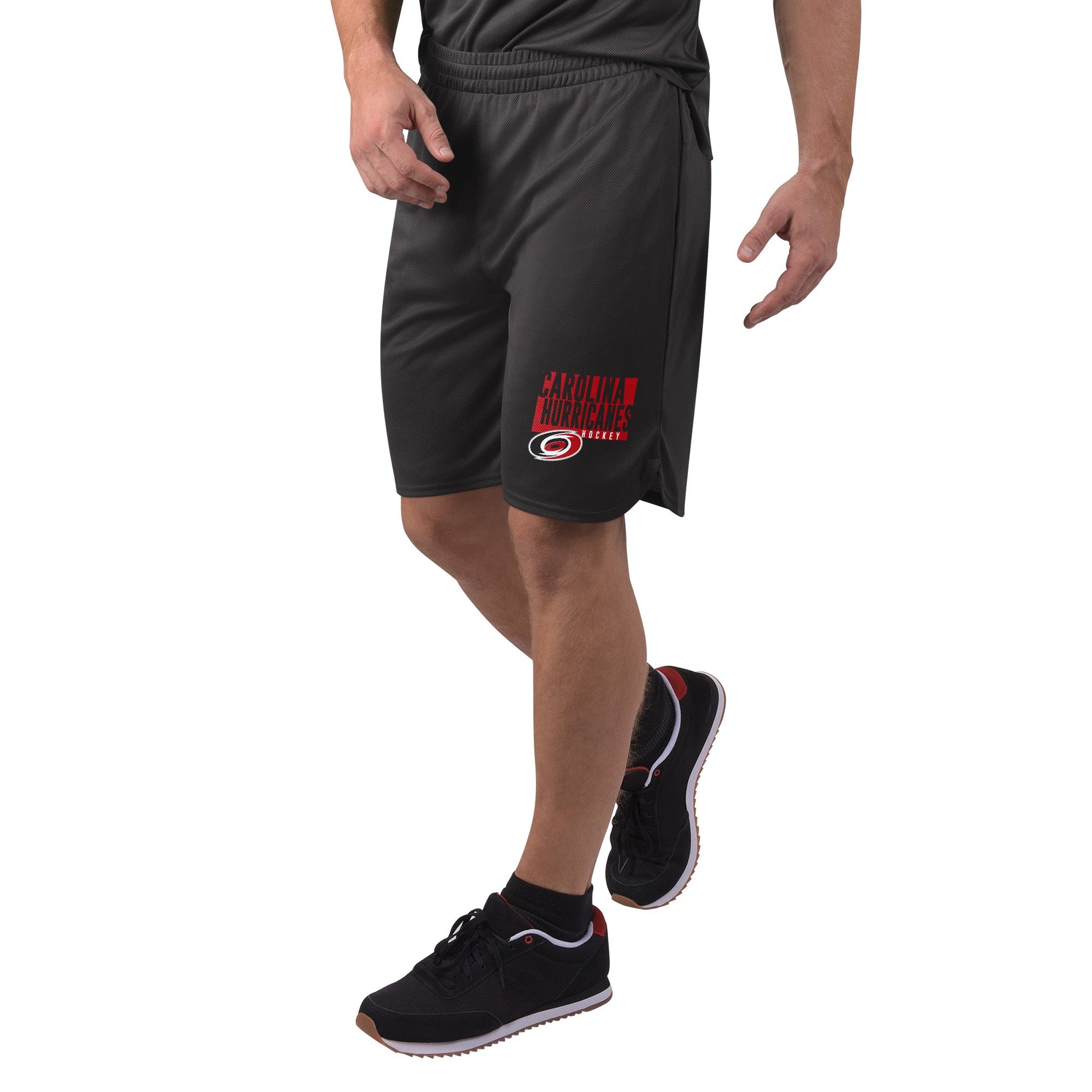 Left Side: Black shorts with red and white Carolina Hurricanes graphic on left pant