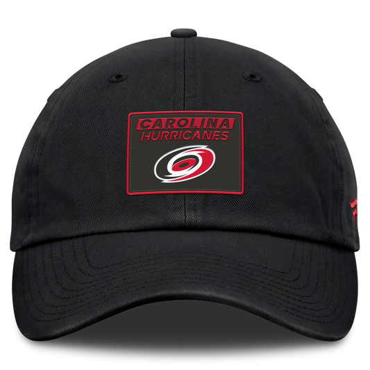 Front: Black hat with red and black patch on front with Carolina Hurricanes graphic