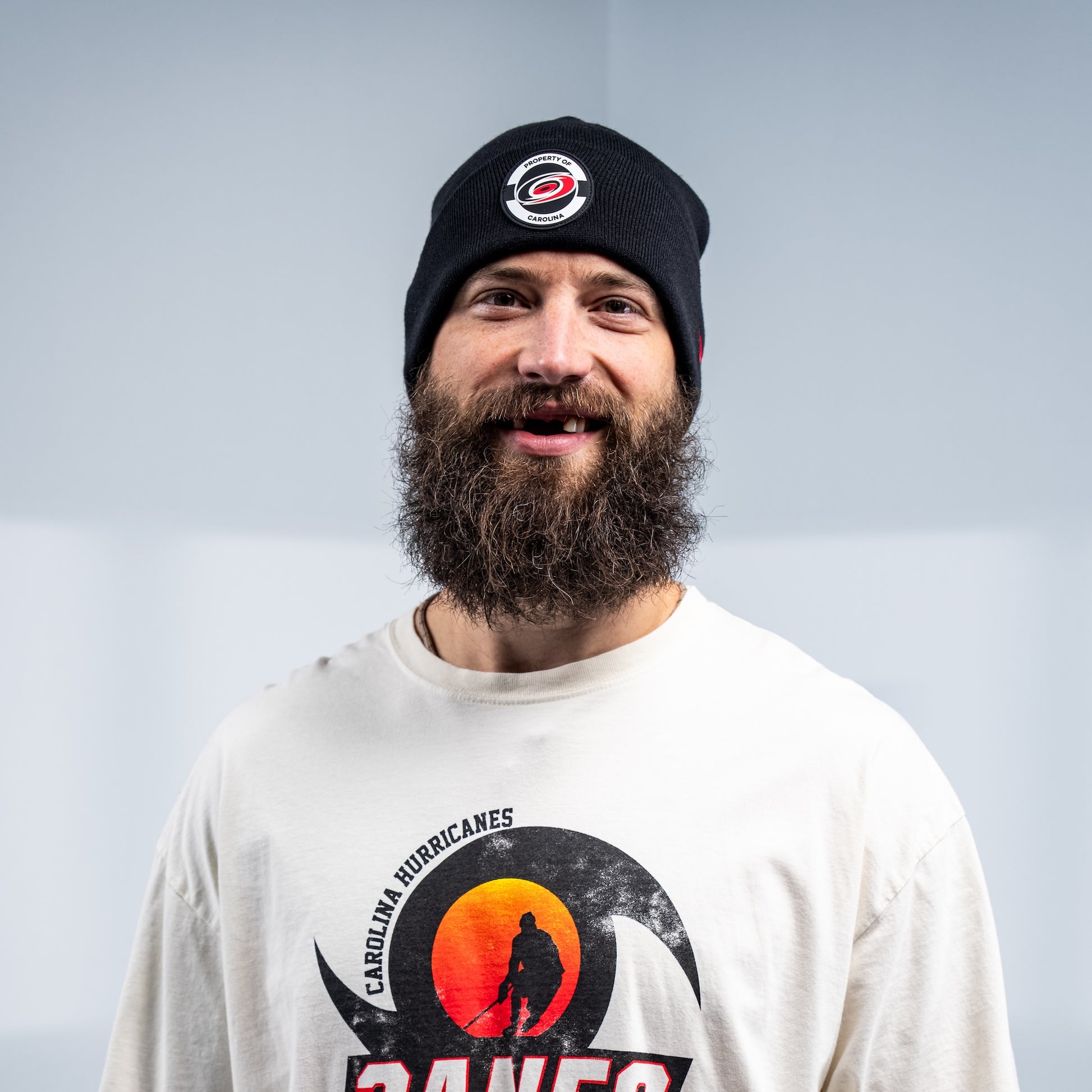 Hurricanes defenseman Brent Burns smiling while wearing the beanie