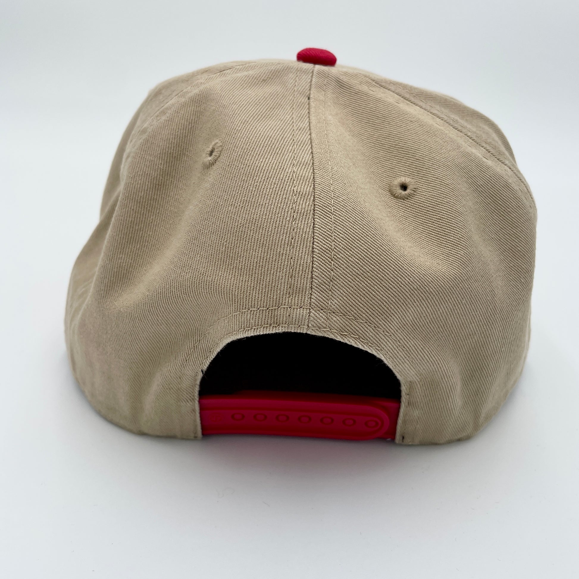 Back: Biege hat with red crown, red snapback straps