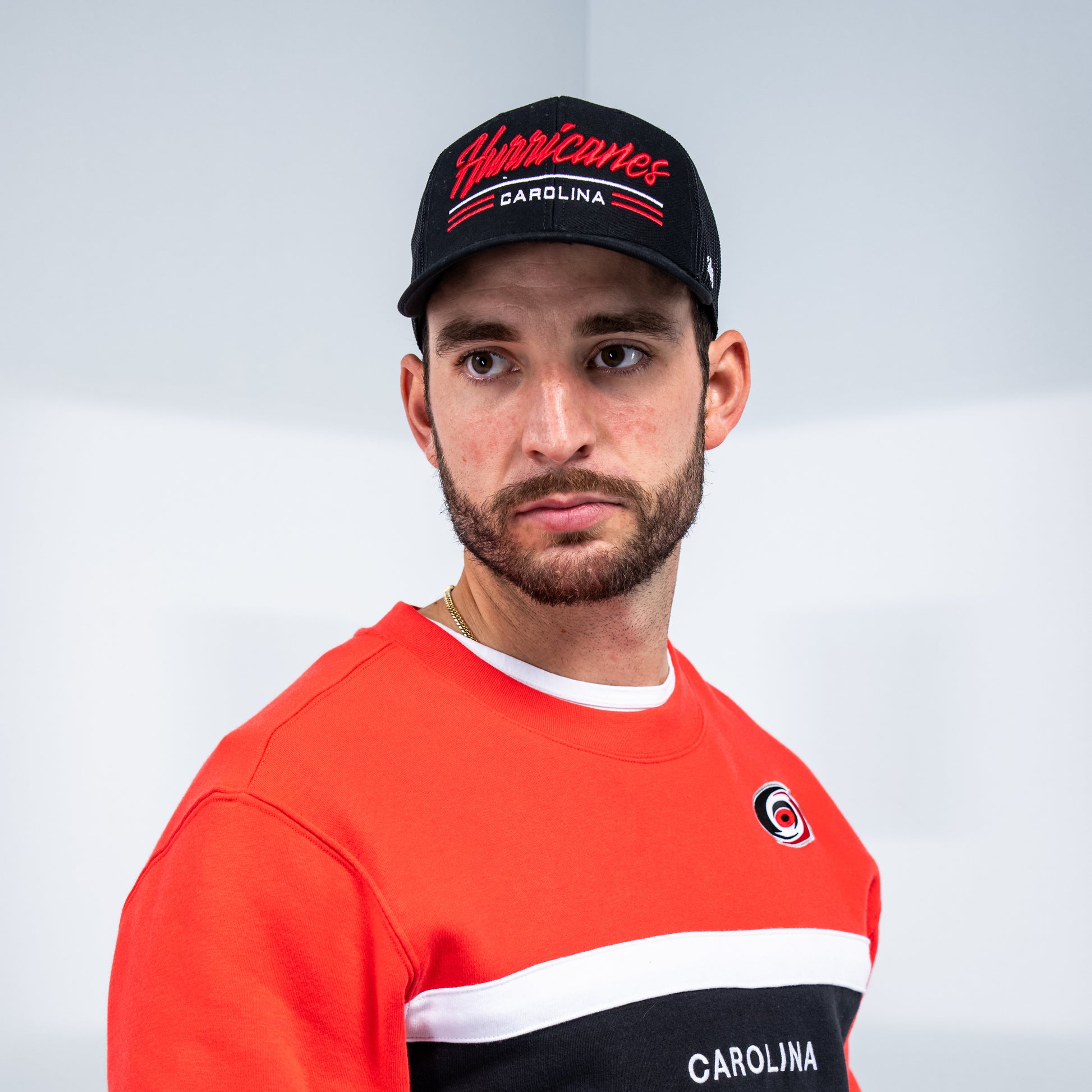 Hurricanes defenseman Shayne Gostisbehere posing while wearing the hat