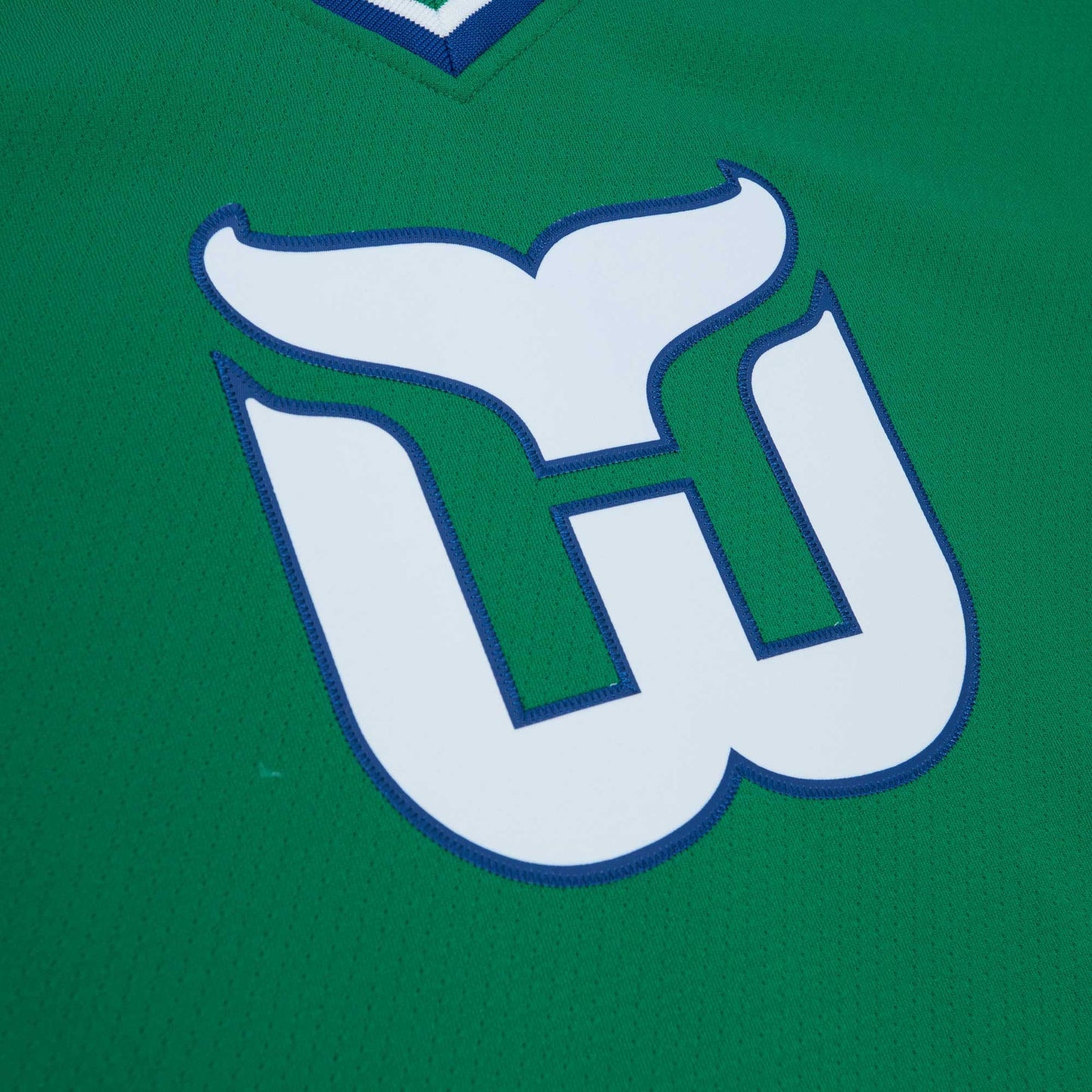 Close up of the Whalers logo on front of jersey