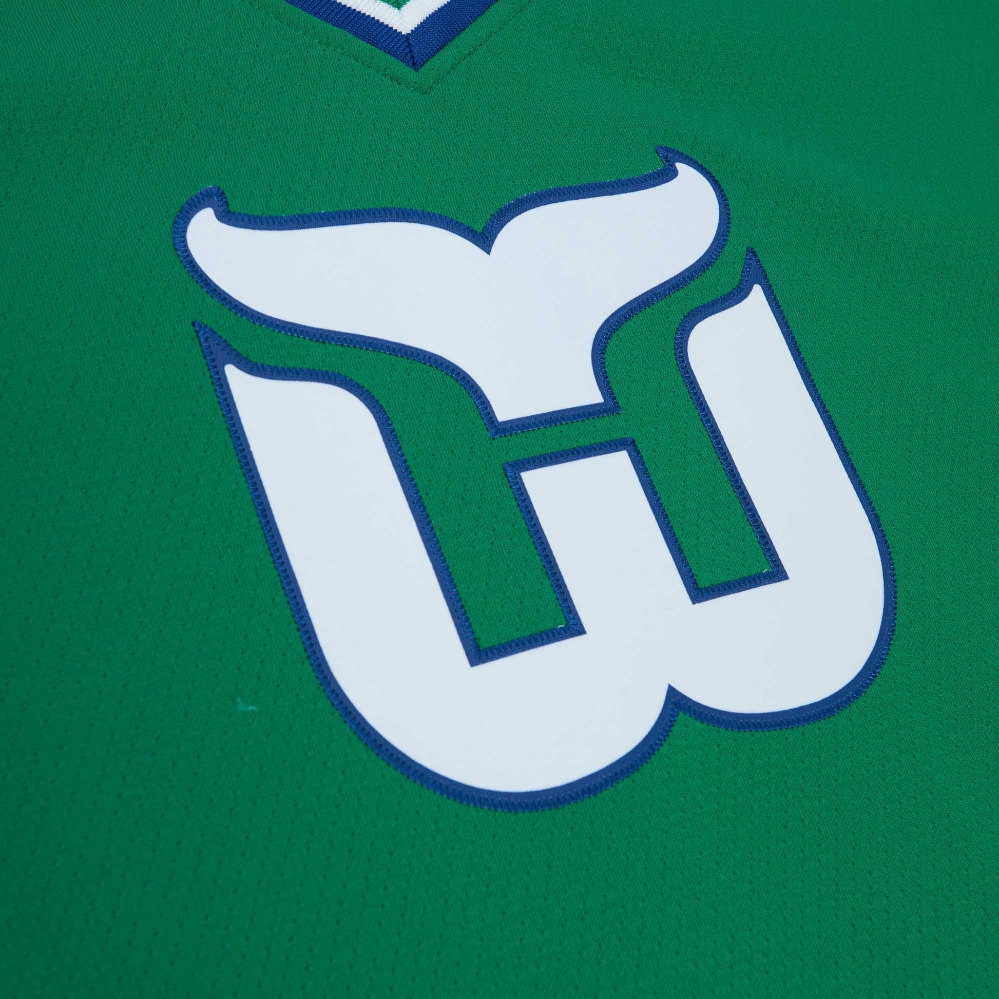 Close up of the Whalers logo on front of jersey