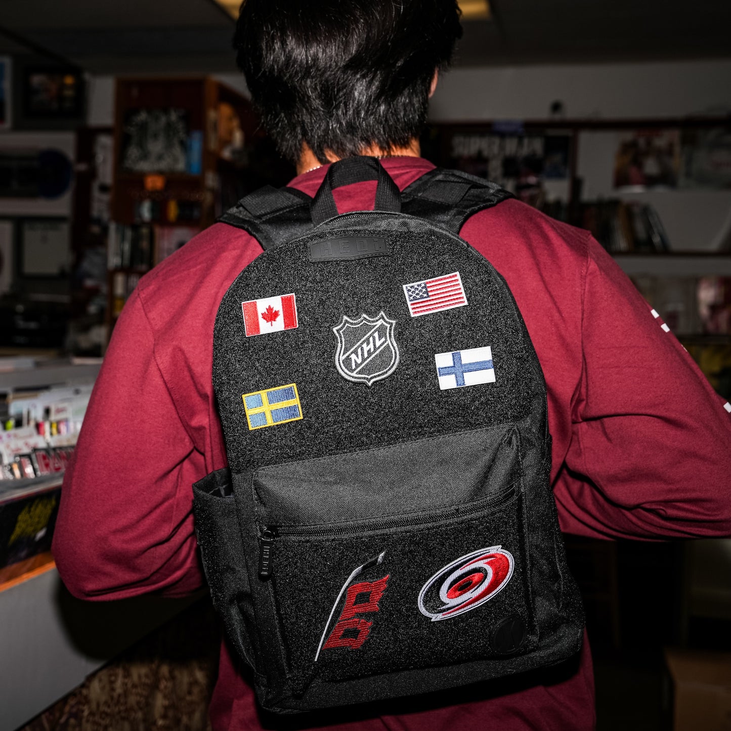 The Finland patch on the back of the HEDi backpack with an assortment of patches