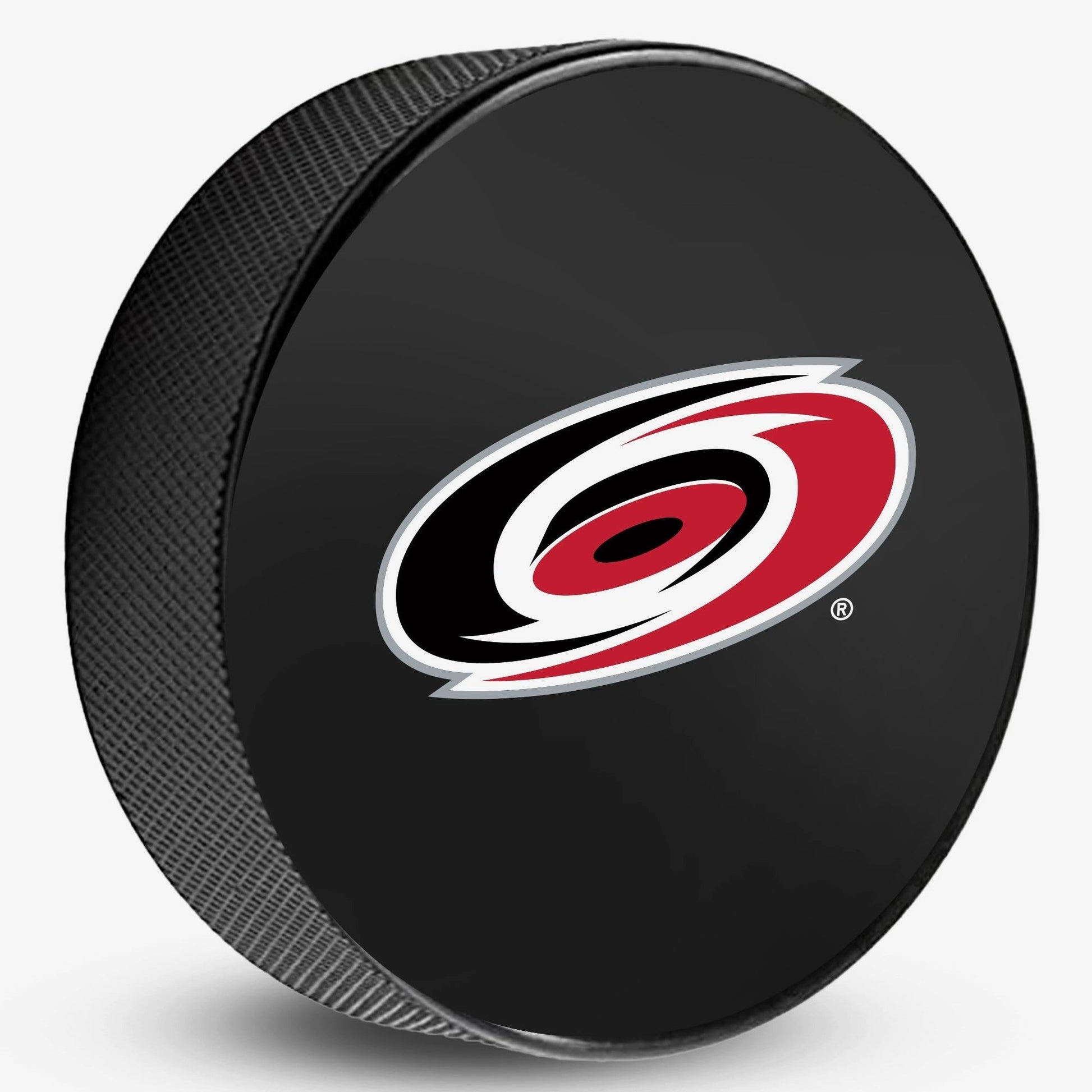 hockey puck with Hurricanes primary logo on front