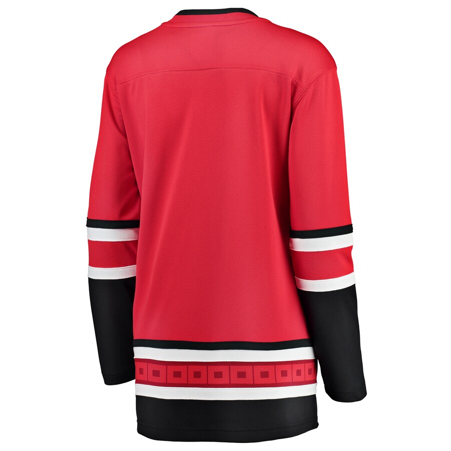 Back: Red jersey with flag striping at waist, black and white trim