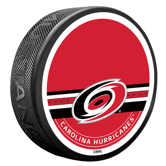 puck with red face that says Carolina Hurricanes with logo and striping with blank space for autograph