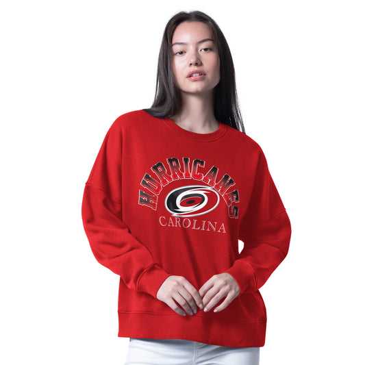 Front: Red sweatshirt, "HURRICANES" arched in gradient around primary logo, "CAROLINA" beneath logo