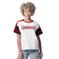 Front: White tee with red/black trim, "Hurricanes" across chest, Flags logo at left hip