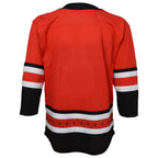 Back: red jersey with black and white trim, flag striping