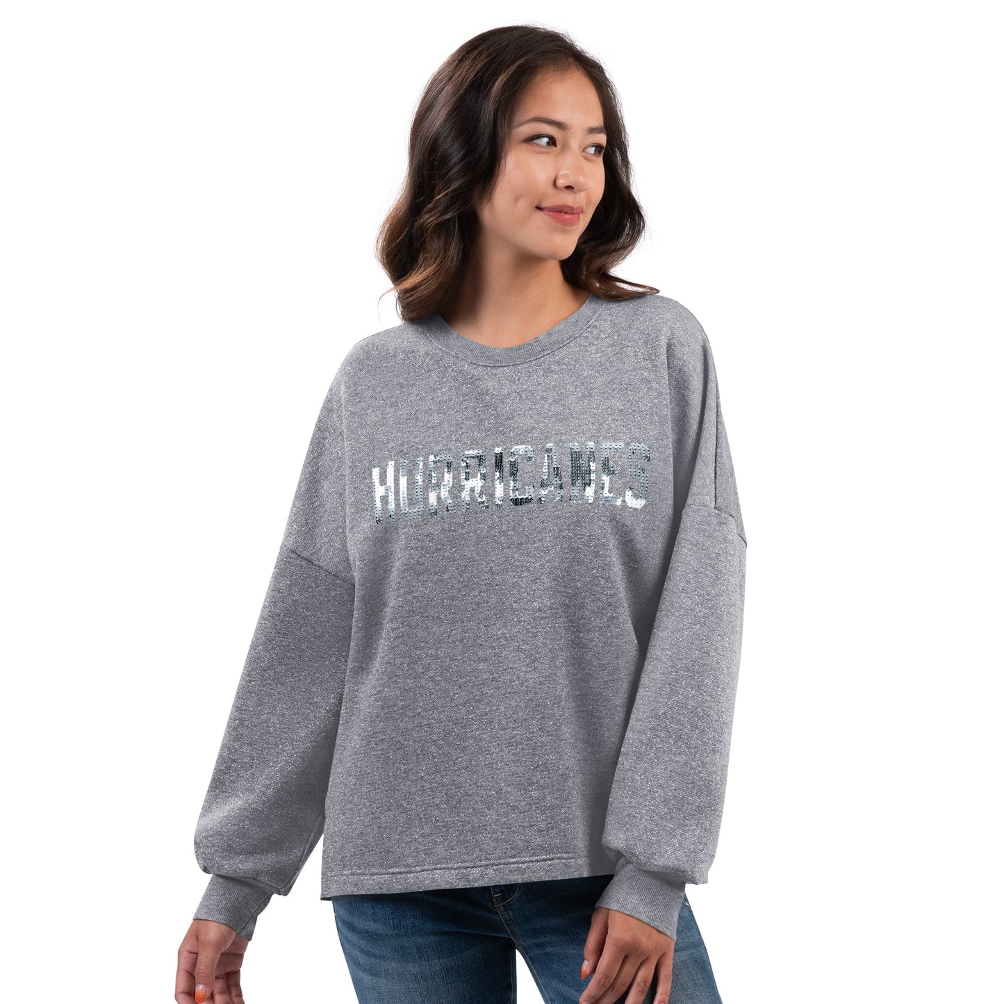 Front: Gray sweater that says Hurricanes across chest in silver sequin