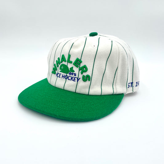 Side: Cream hat with green pinstripes, green brim, says "EST. 1979" on left