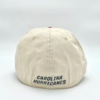 Back: Cream fitted hat with red crown, Carolina Hurricanes wordmark in black