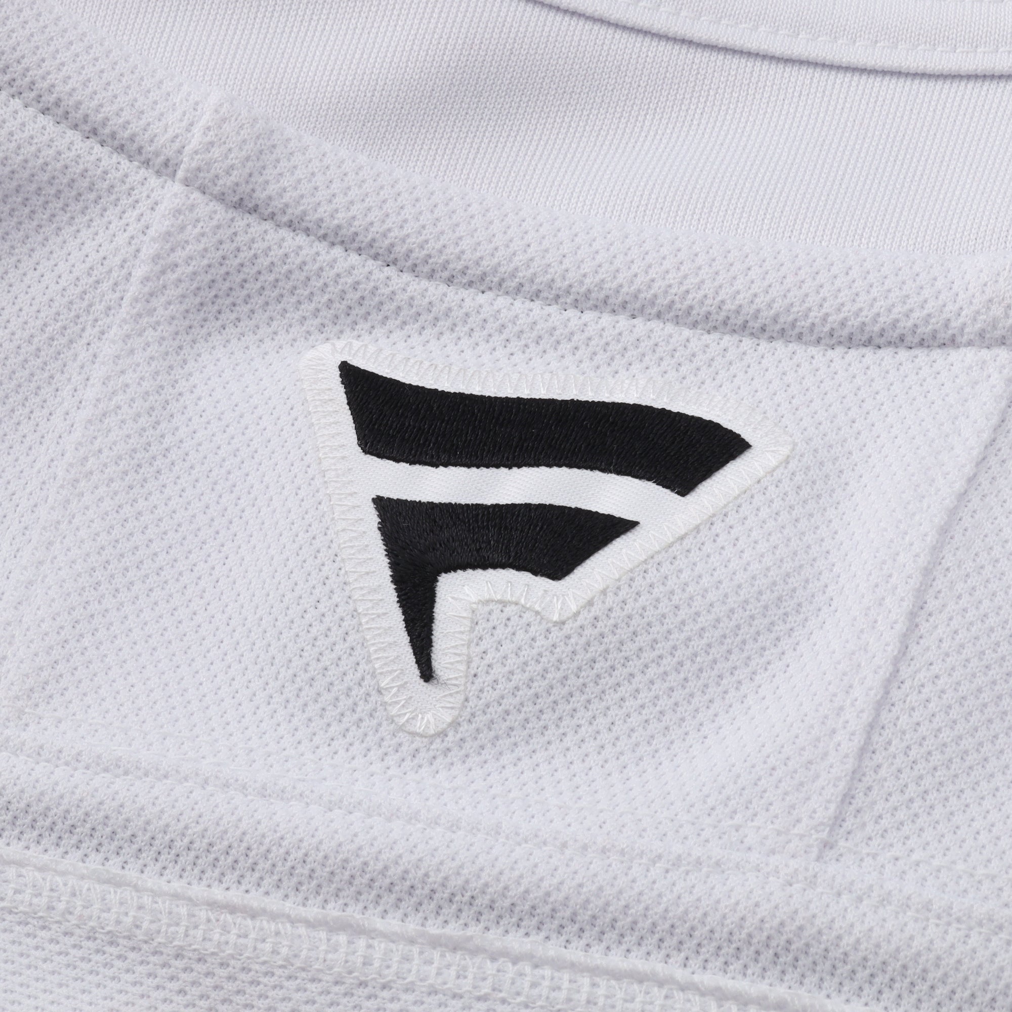 Close up of black Fanatics logo on back of neckline
