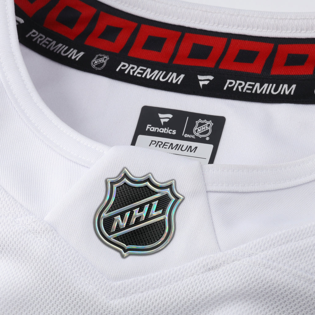 Close up of holographic NHL Shield on front at neckline