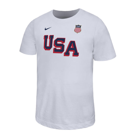 White tee, "USA" wordmark in red/blue, Nike logo top right, USA badge top left