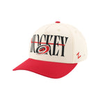 Front Left: White hat, red brim, artwork featuring Primary logo, hockey stick on front