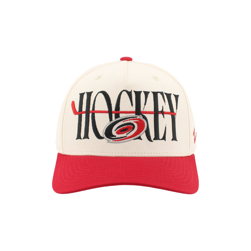 Front: "HOCKEY" in black with red hockey stick through wording, Primary logo overtop lettering