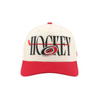 Front: "HOCKEY" in black with red hockey stick through wording, Primary logo overtop lettering