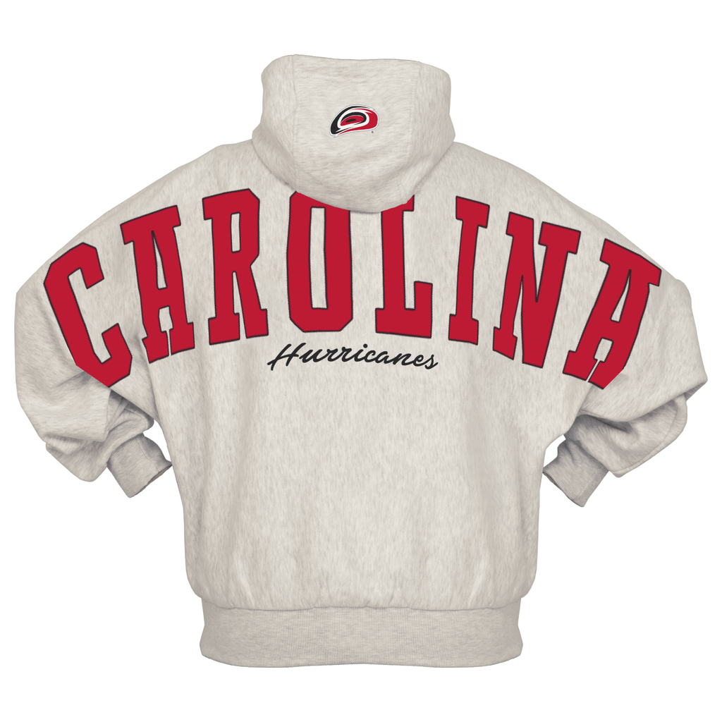 Back: "CAROLINA" in red across back/sleeves, "Hurricanes" in cursive below, Primary logo on hood