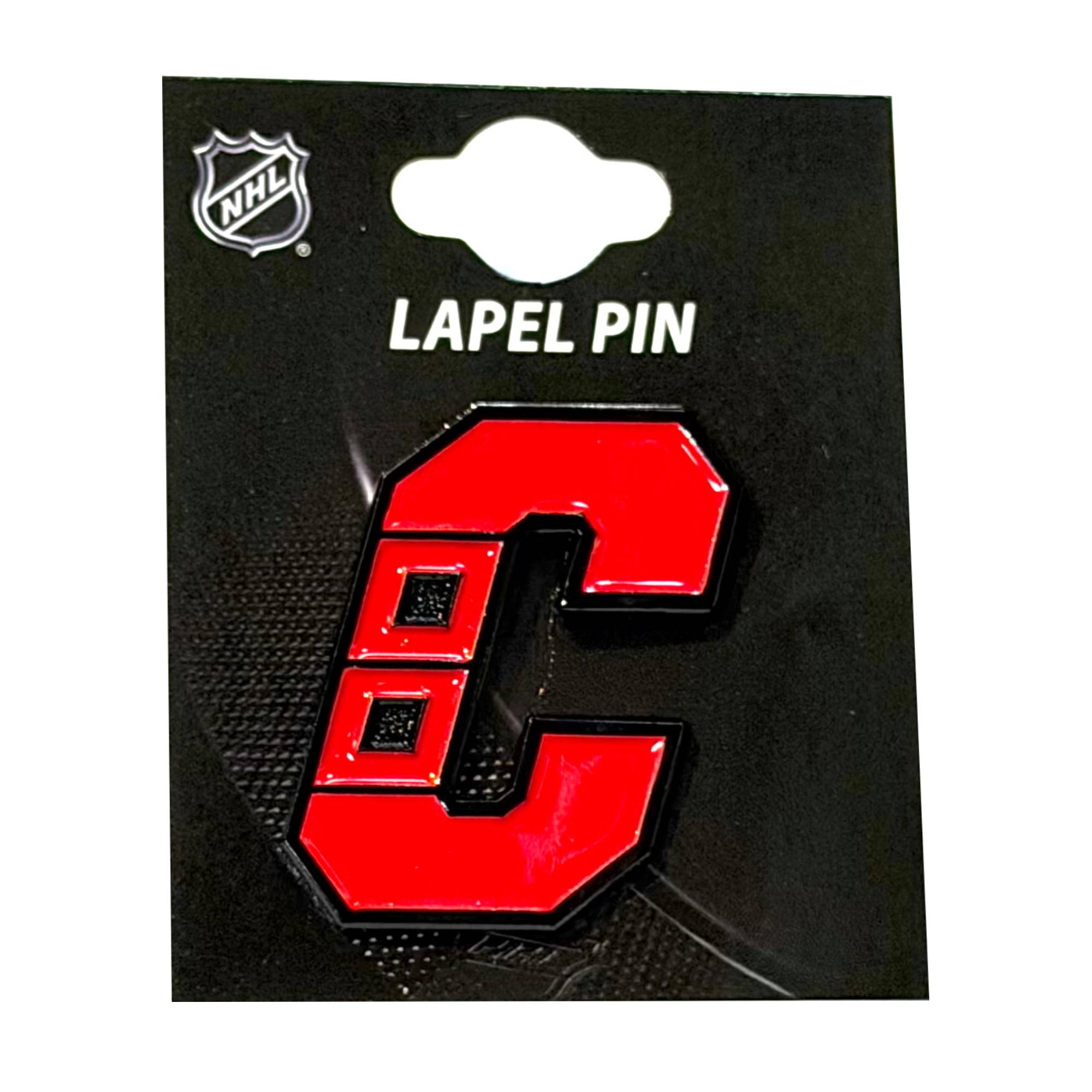 Lapel pin of the Warning 'C' logo