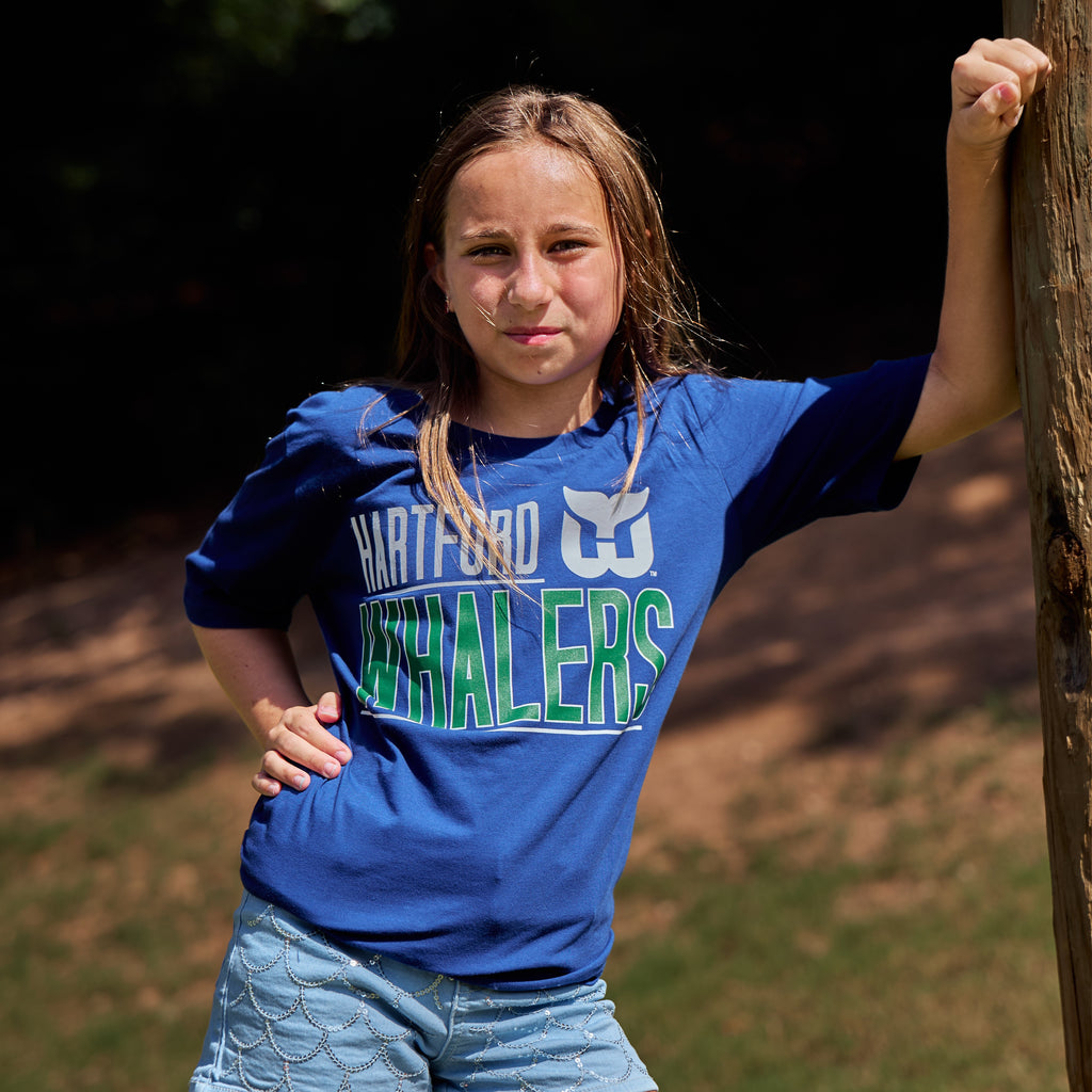 The tee being worn outdoors by a model