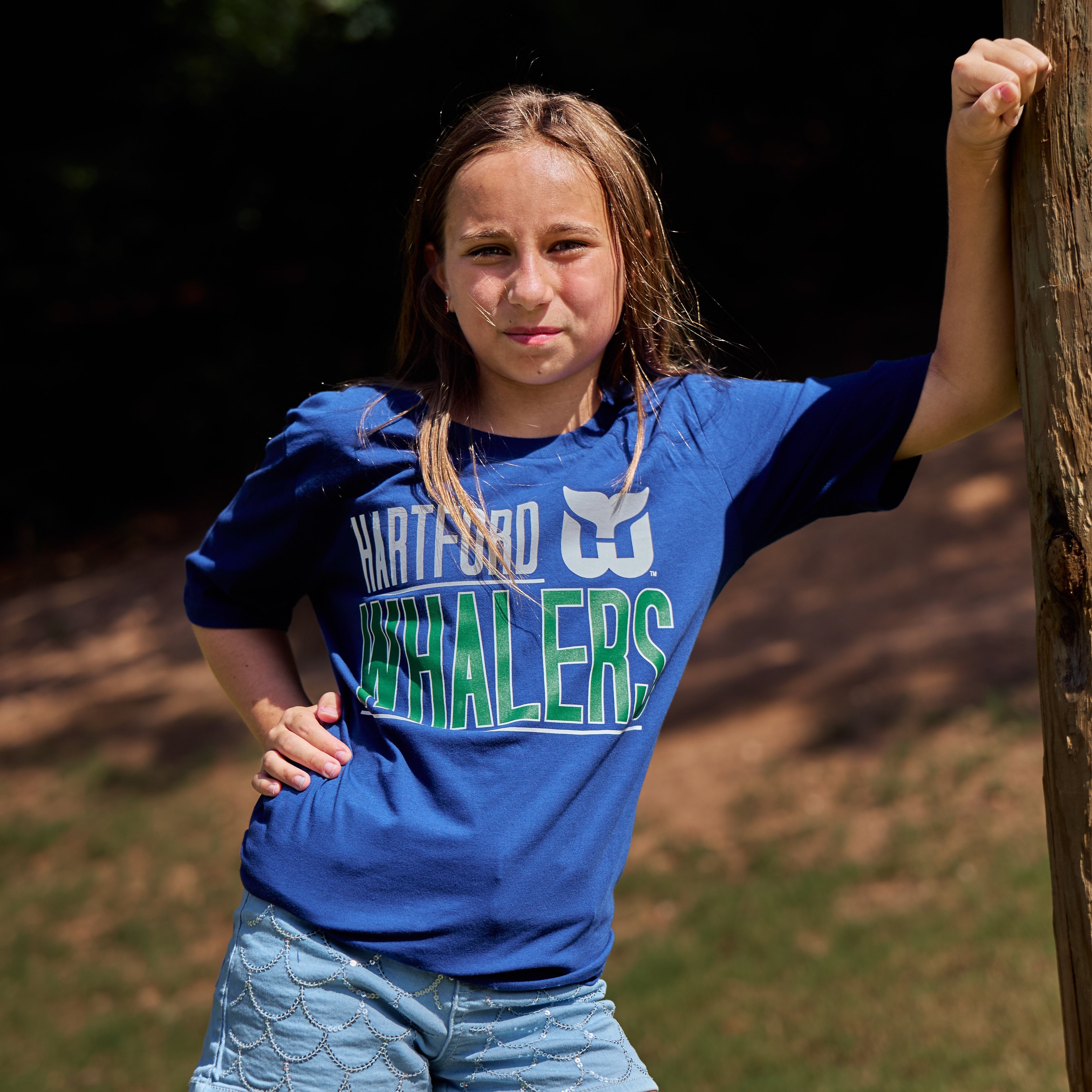 The tee being worn outdoors by a model