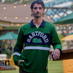 The top being worn by a model in an outdoor space