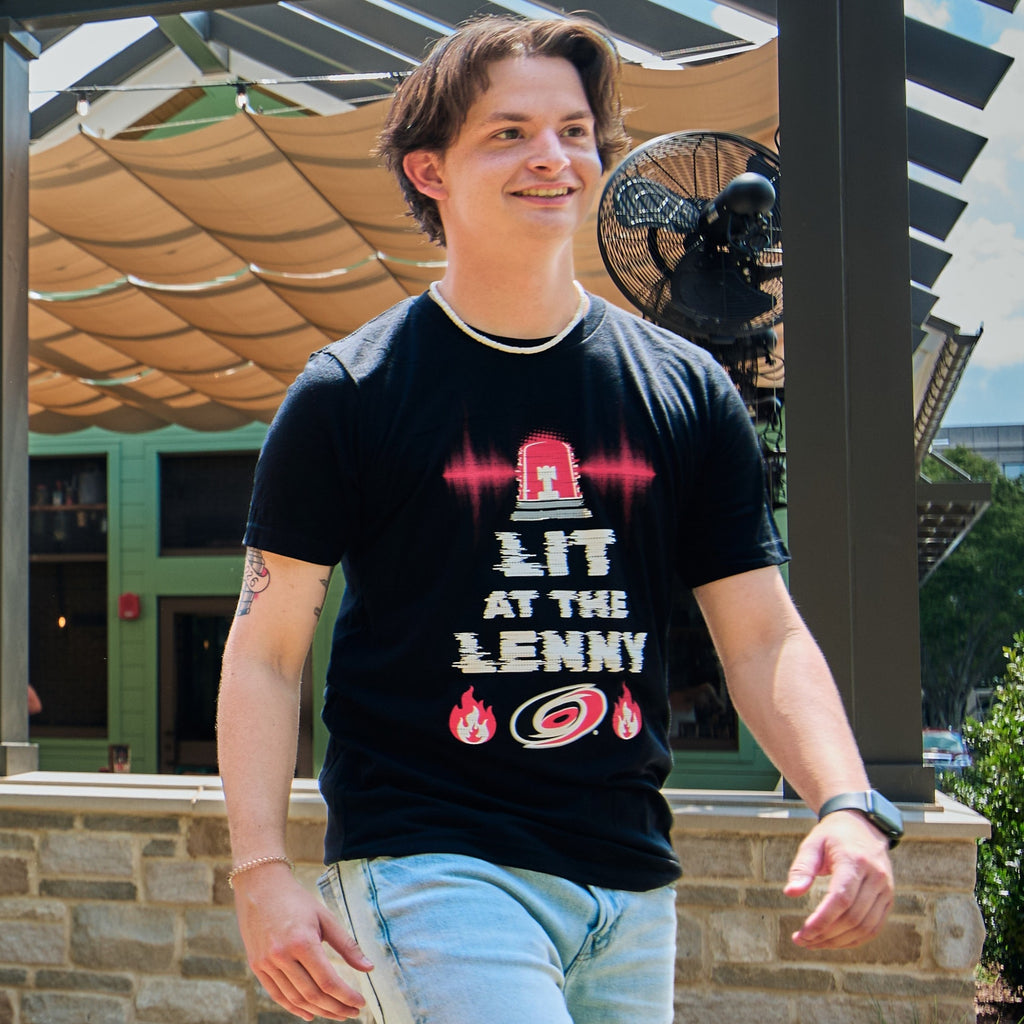 The tee being worn by a model in an outdoor area