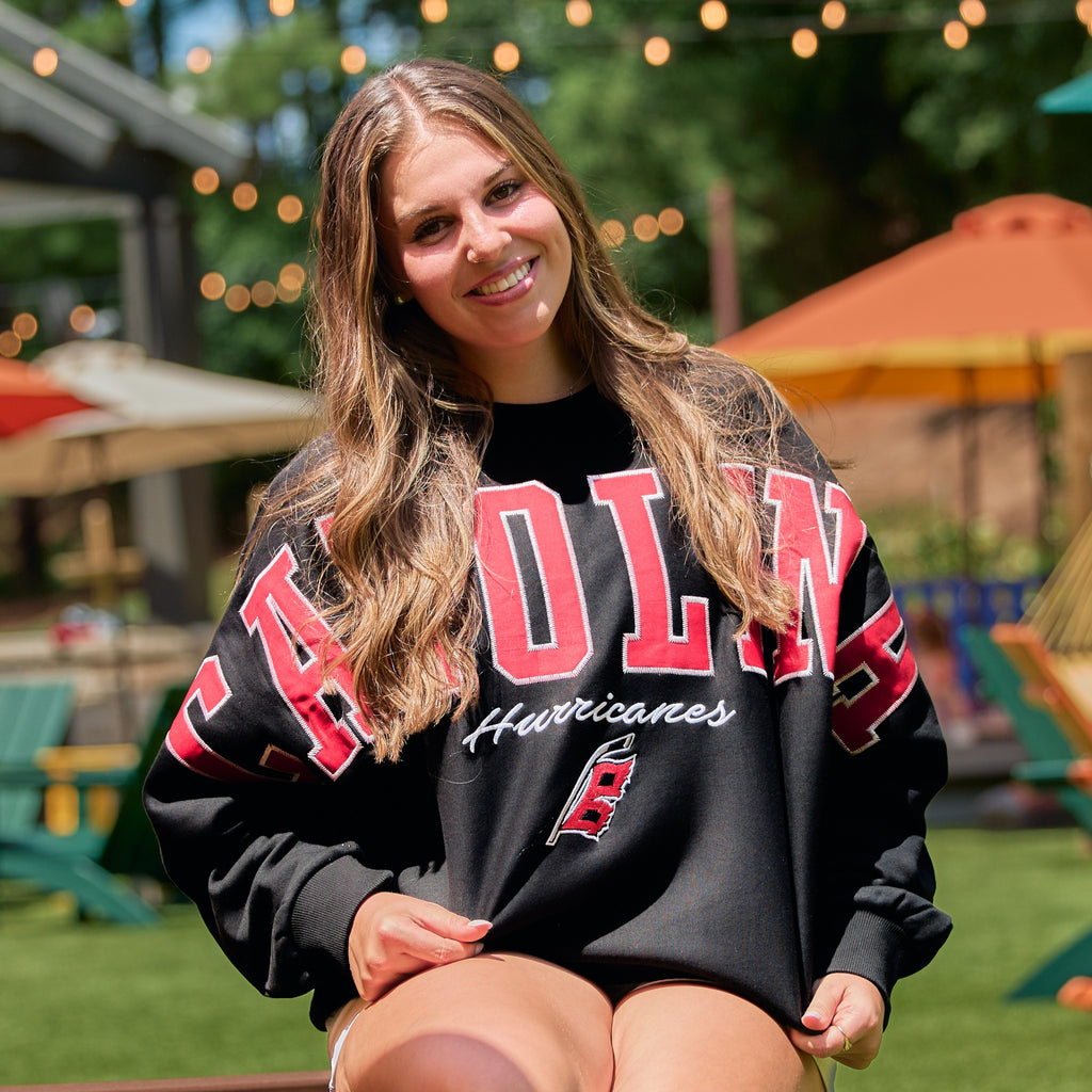 The crew being worn by a model in an outdoor setting