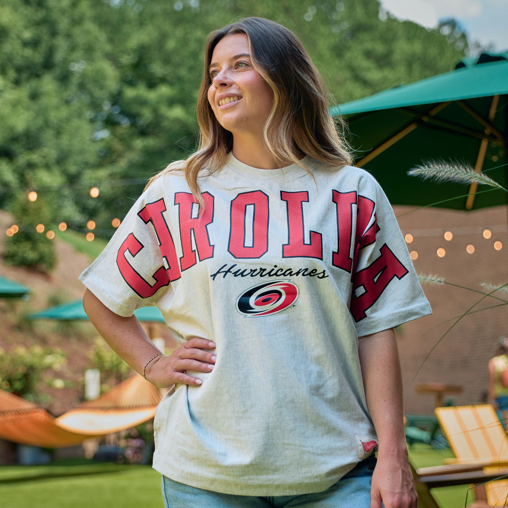 The t-shirt being worn by a model in an outdoor area