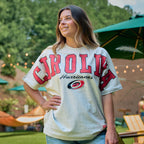 The t-shirt being worn by a model in an outdoor area