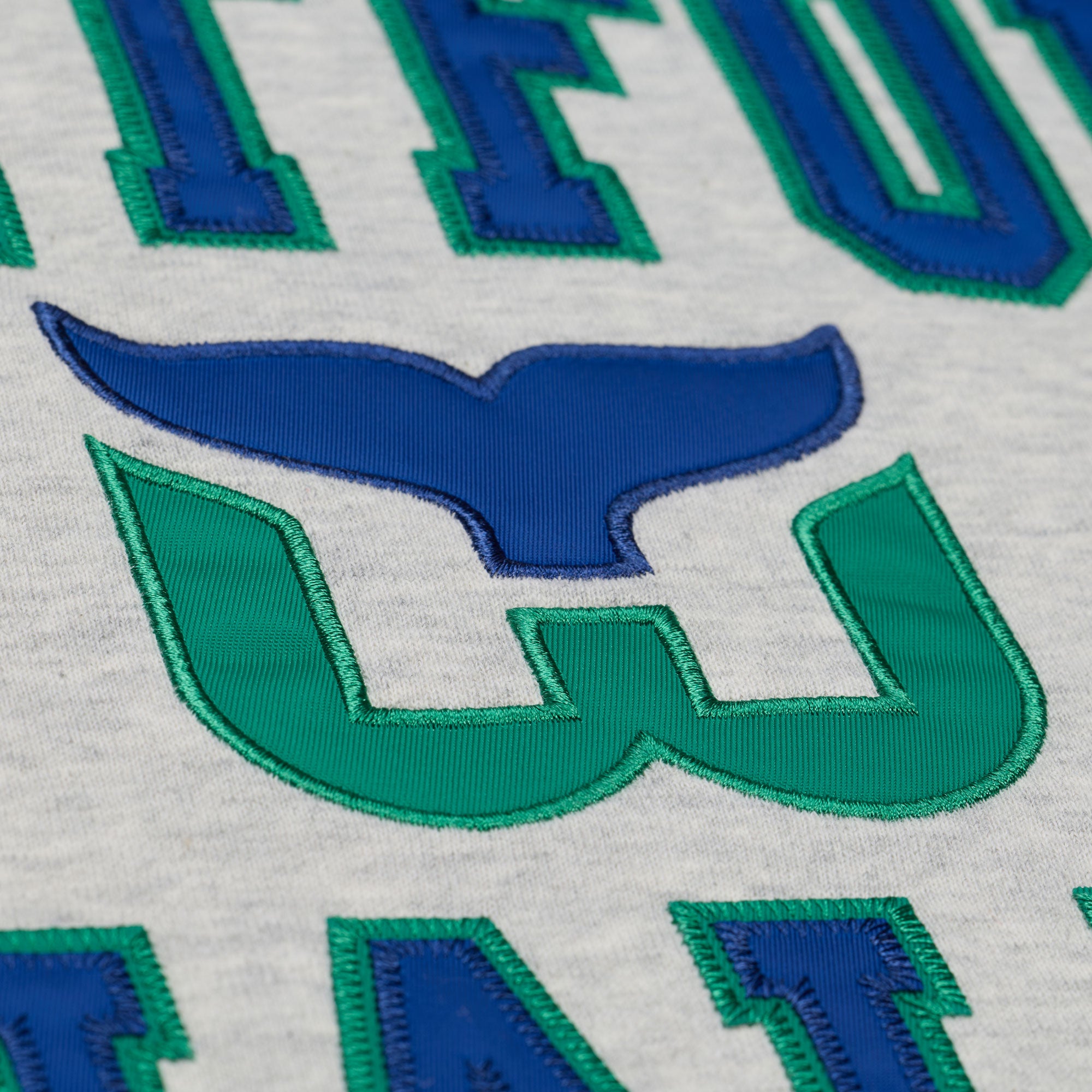 Close up of the Whalers Tail logo on the front