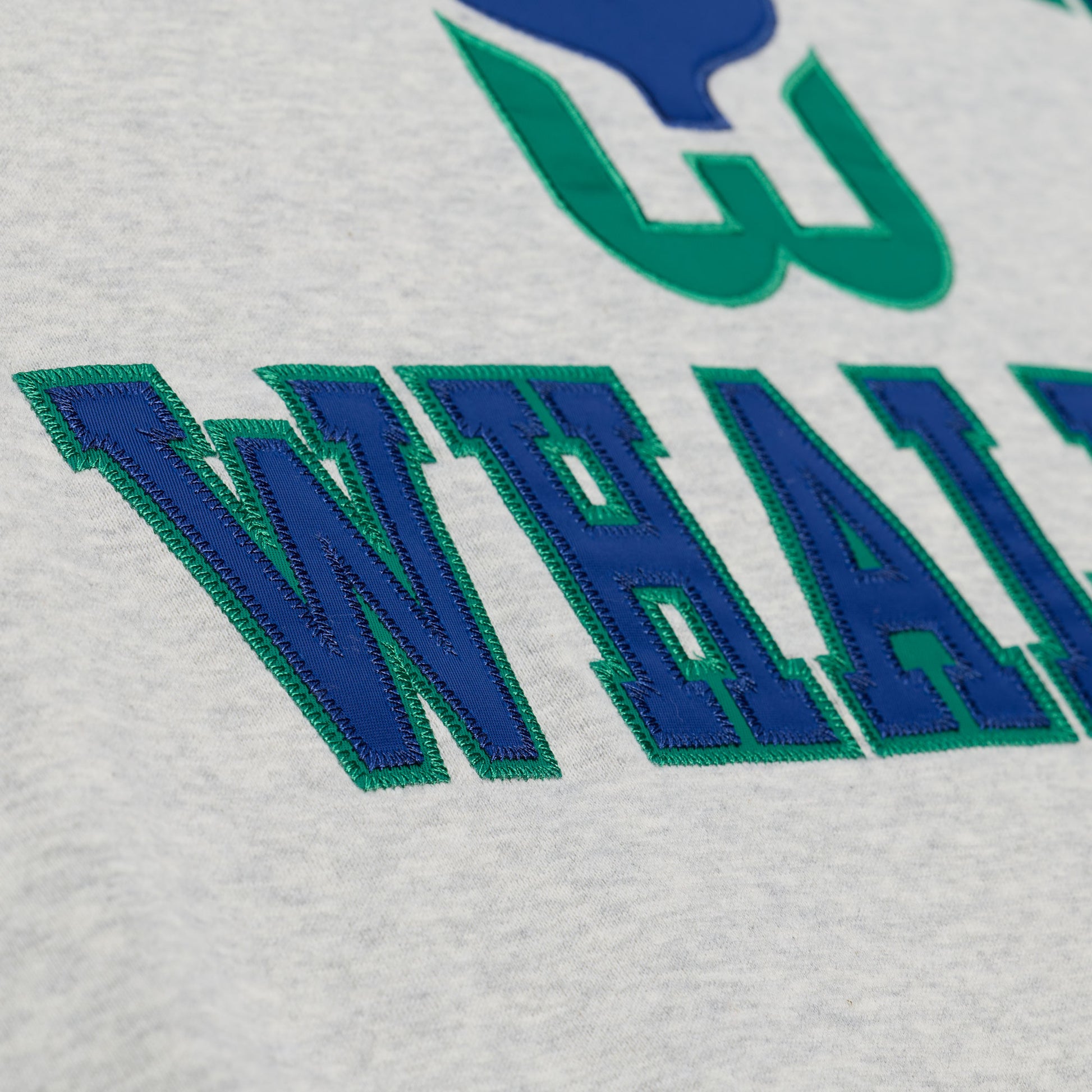 Close up of the "WHALERS" on the front of crewneck