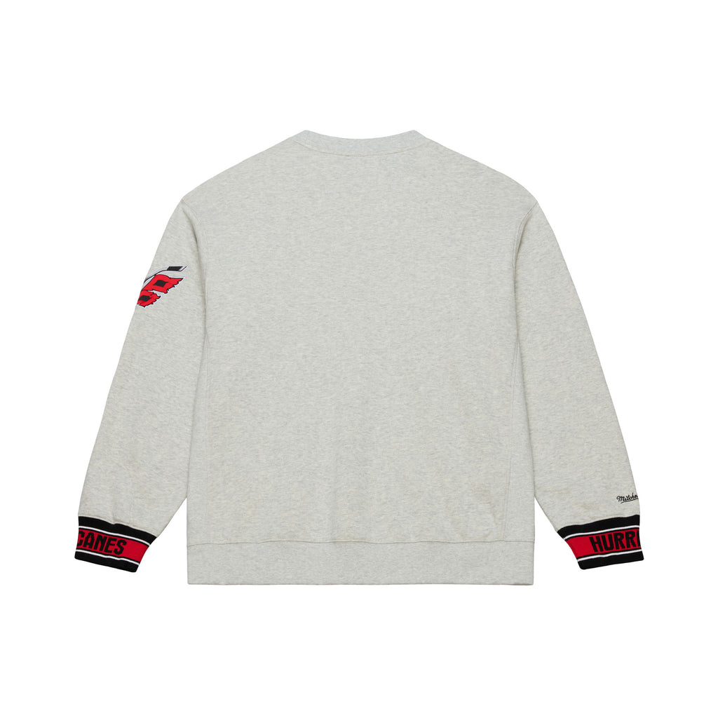 Back: Gray crewneck, red/black/white striped wrists with "HURRICANES" in black