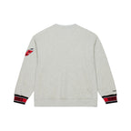 Back: Gray crewneck, red/black/white striped wrists with "HURRICANES" in black