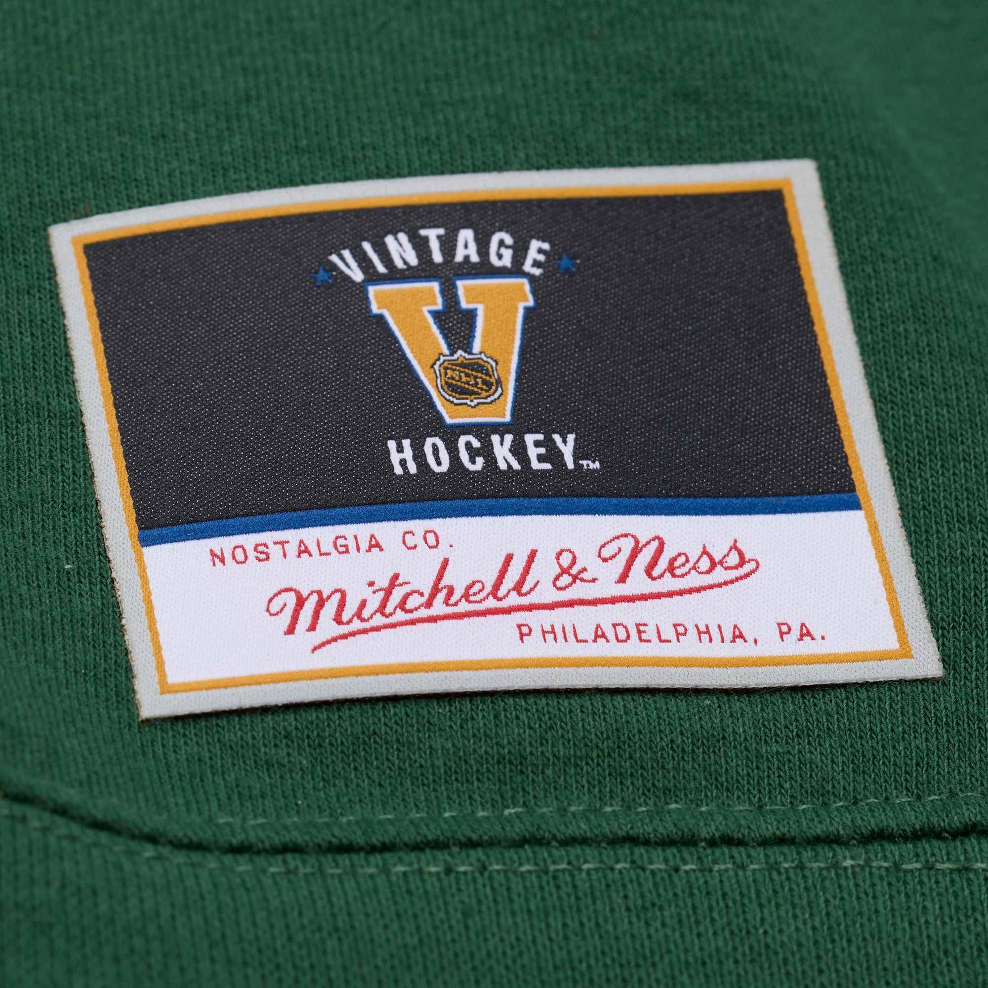 Close up of the Vintage Hockey Mitchell & Ness tag on front