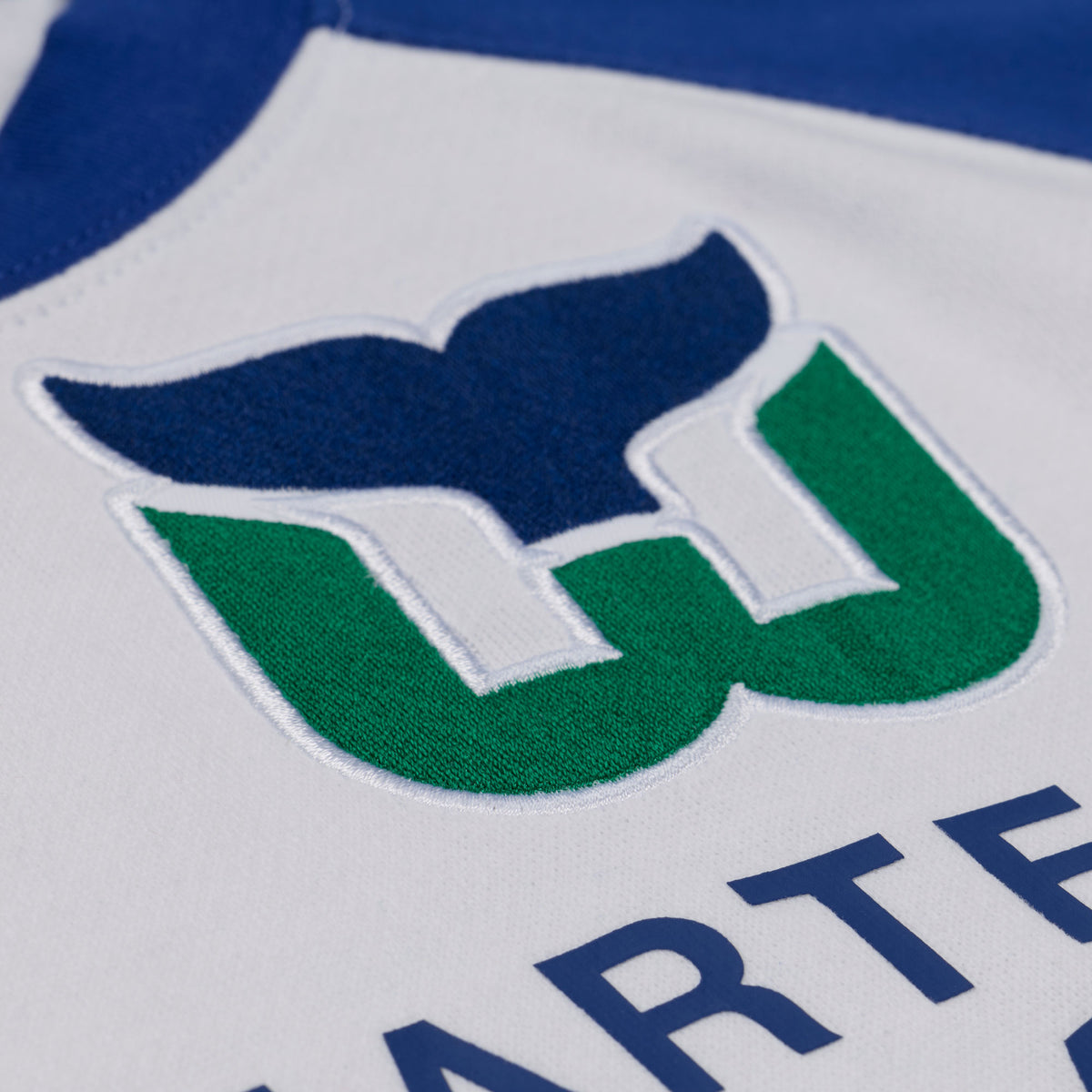 Close up of the Whalers Tail logo on the front
