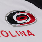 Close up of the Primary logo on the front of the crew
