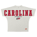 White tee, "CAROLINA" across chest/sleeves in red, "Hurricanes" in cursive with Primary logo beneath